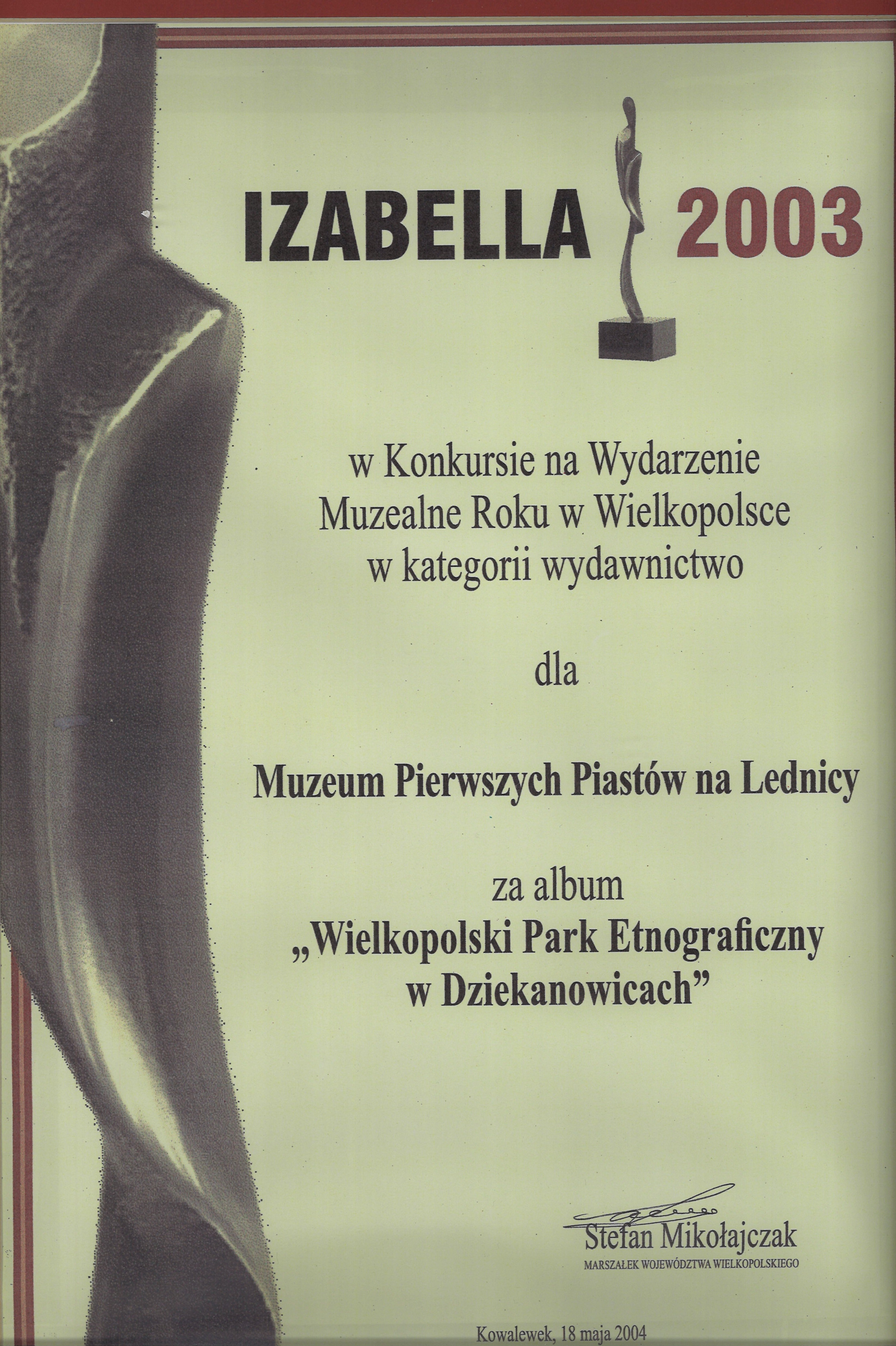 Dyplom nagrody Izabella z widoczną statuteką  